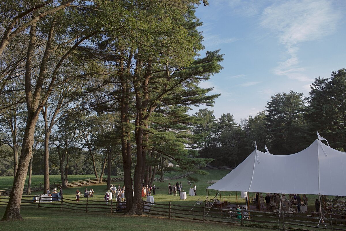 Landscape of a tented wedding reception at a private estate.