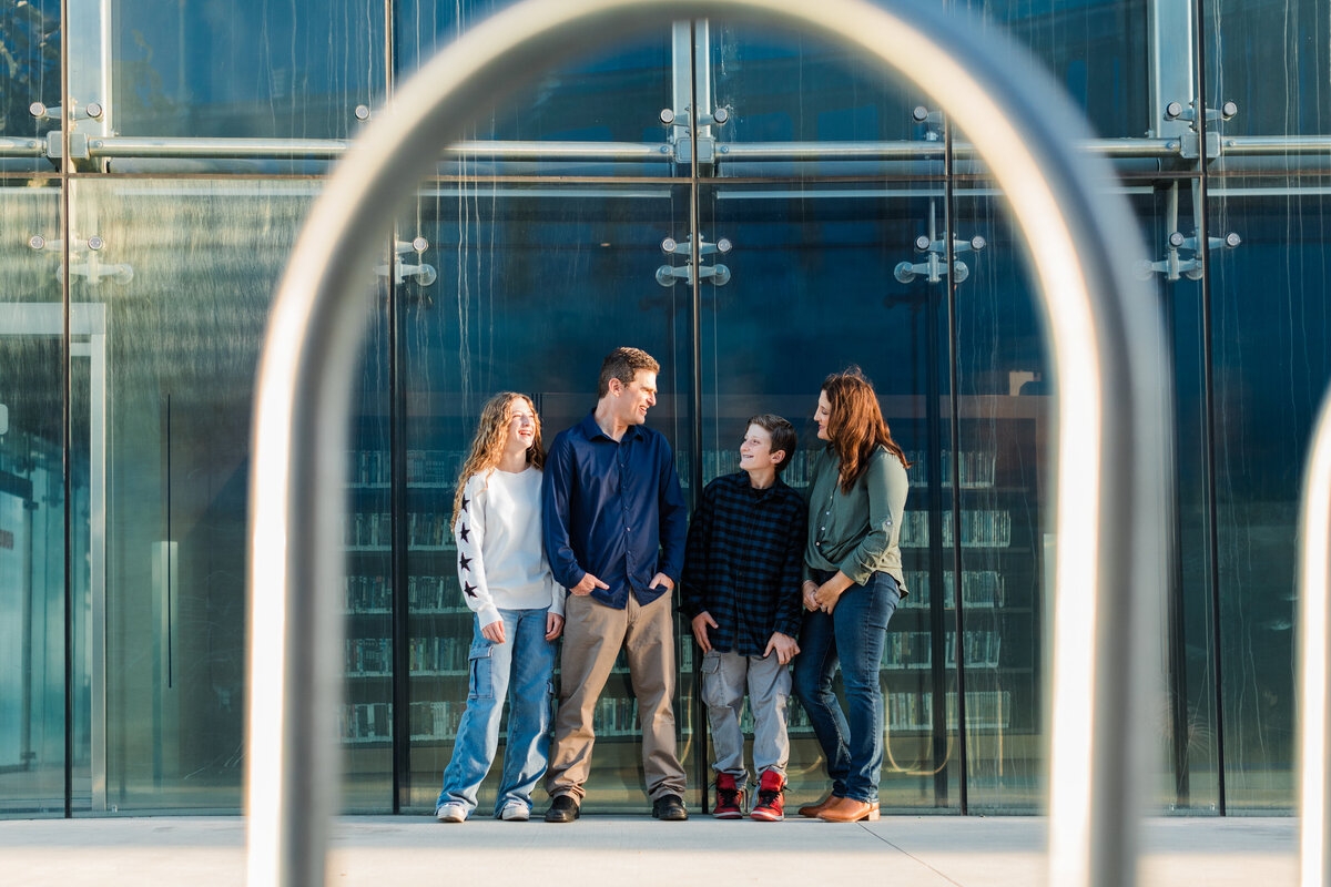 family-at-manhattan-beach-library-framed-by-bicycle-rack