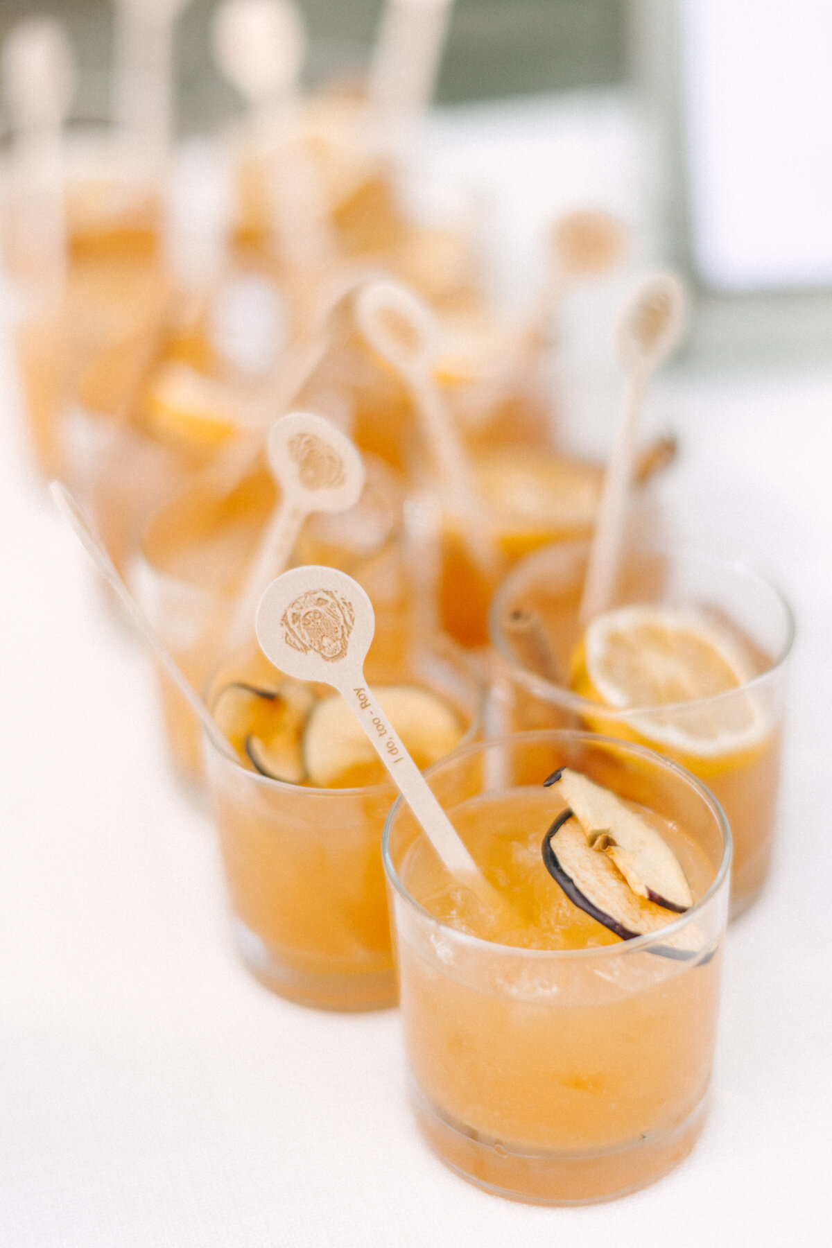 signature drinks at wedding with custom stir stick