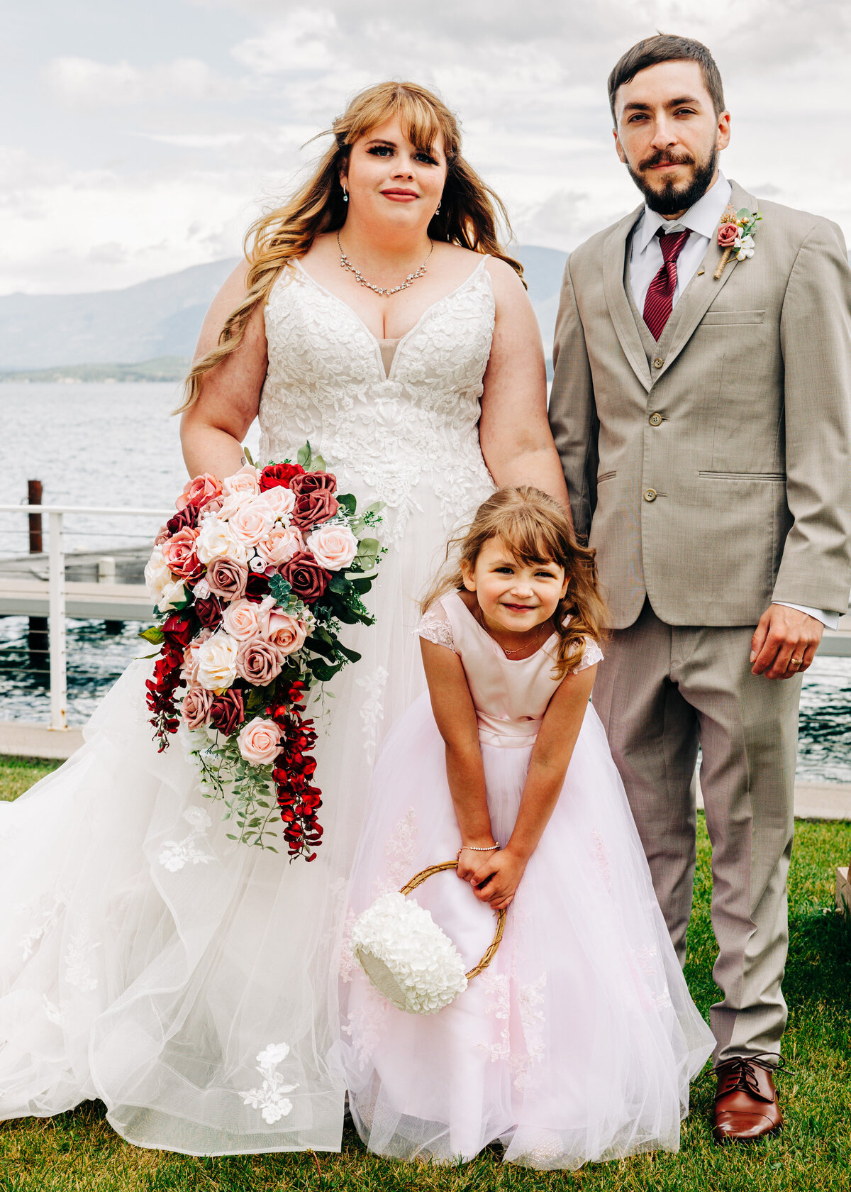 Family portrait bride, groom, and daughter at Kwataqnuk Resort in Polson, MT