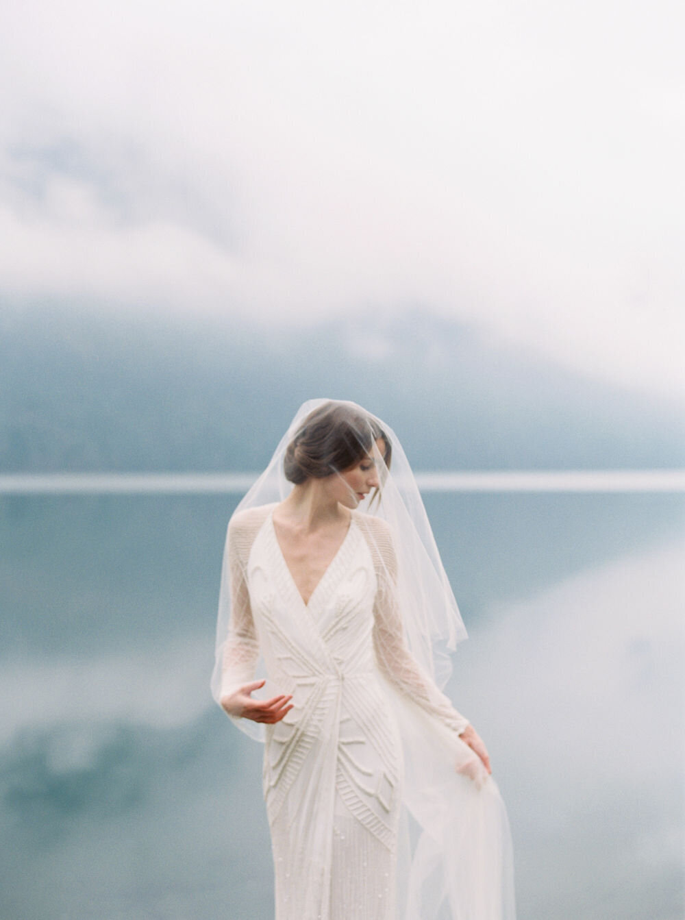 Bride in ethereal veil in the fog in Los Angeles