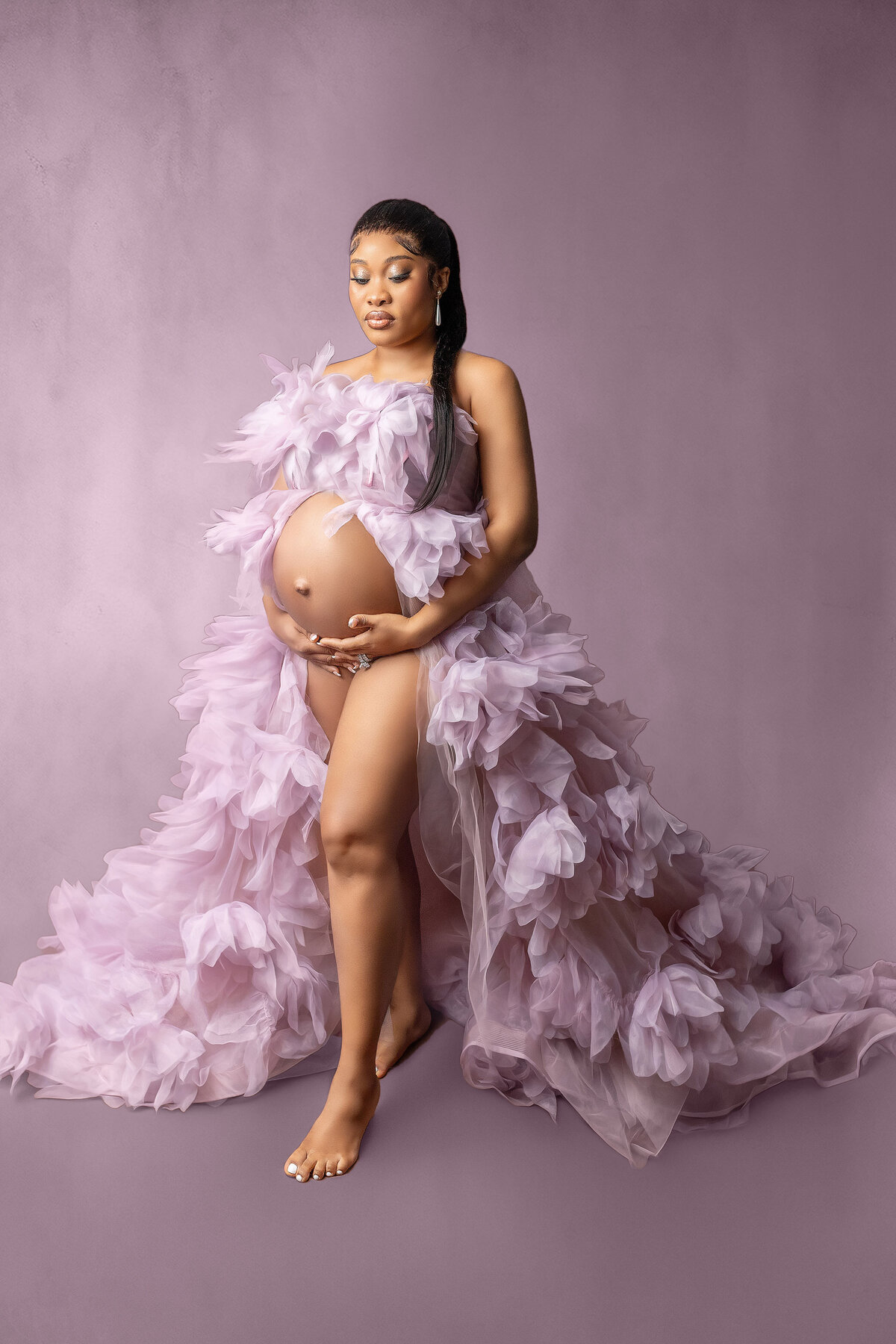 stunning pregnancy photoshoot in hamilton showcases beautiful mama in purple fluffy gown