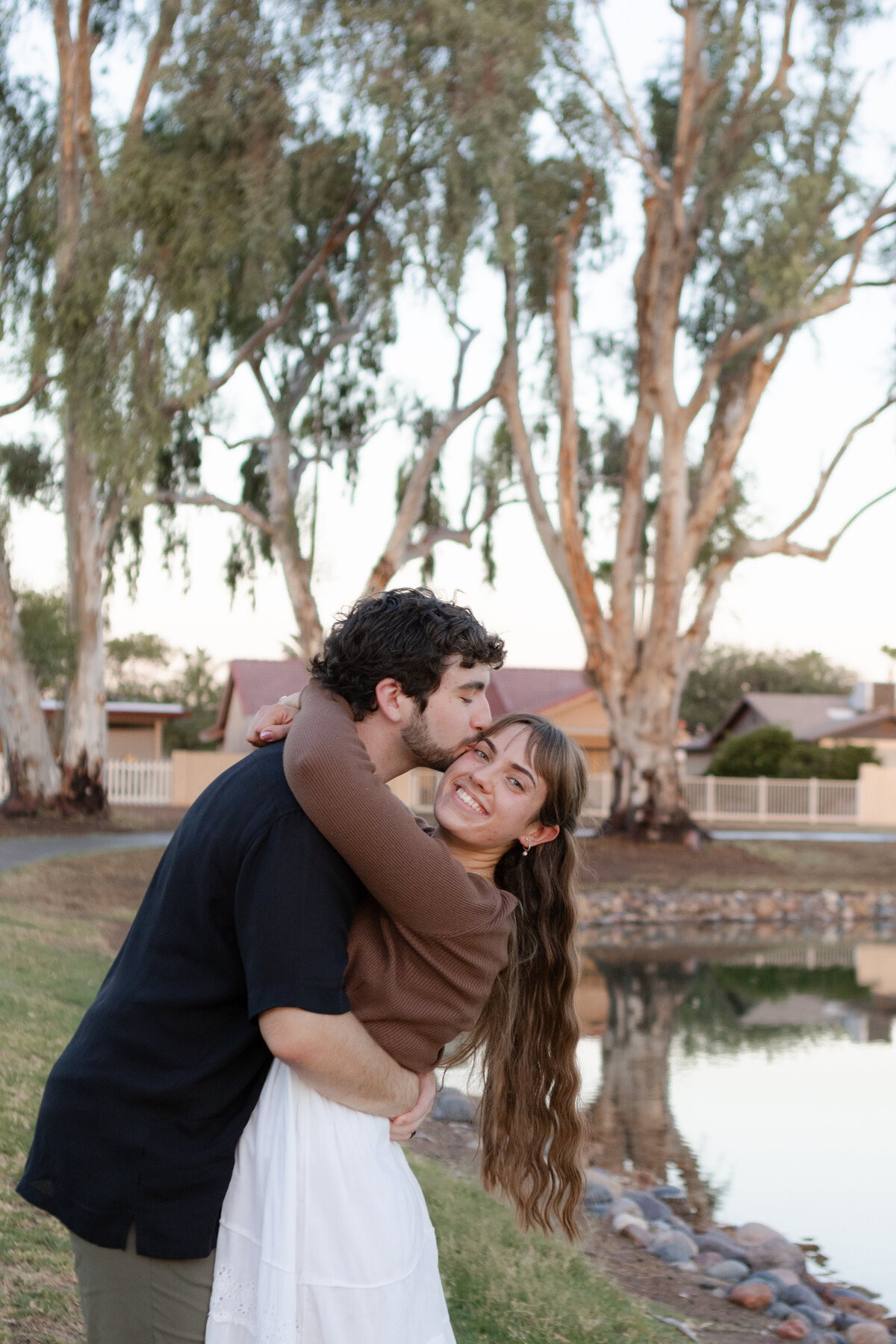 Jovanna G Photography. Classic, sophisticated Wedding Photos. Soft romantic engagement photos. Soft romantic WeddingPhotos. Sophisticated Wedding Photographer. Professional Wedding Photographer. Destination Wedding Photographer. Luxury Wedding photographer. Traveling Wedding Photographer. AZ Wedding Photographer. Gilbert AZ Wedding Photographer. Queen Creek Wedding Photographer. Phoenix Wedding Photographer. Scottsdale Wedding Photographer. Flagstaff Wedding Photographer. SoCal Wedding Photographer. California Wedding Photographer. Northern California Wedding Photographer. Southern California Wedding Photographer. San Francisco Wedding Photographer. Bay Area Wedding Photographer. San Jose Wedding Photographer. Golden Gate Bridge Wedding Photographer. Beach Lover Wedding Photographer. Palace of the Fine Arts Wedding Photographer. Ocean Lover. I love California. Orange County Wedding Photographer. Newport Beach Couples Photographer. Newport Beach Wedding Photographer. Laguna Beach Couples Beach Engagement Photographer. Laguna Beach wedding beach photographer. Los Angeles Wedding Photographer. Young and in love engaged couples who live in southern California. Christian Young Couple. Young Engaged Couple. Engaged High School Christian Couple. Christian Values. Young conservative Christian women. Young Conservative Christian men. Young Conservative Christian Couple. Young Christian Couple Engaged in High School. Young Christian College Couple. Lakeside Lovers in the Autumn Sun. David & Grace - engagement photos. Jovanna G Photographer Engagement Photos. Arizona sun shining through autumn trees- engagement. Chandler, AZ Engagement Photos. Chandler, AZ 2026 bride. Chandler, AZ Wedding Photographer. Chandler, AZ Young Engaged Couple. Girl in her 20s. Engaged Arizona Girl in her 20s. Lakeside Engagement photos. AZ Lakeside Engagement Photos. AZ Weeping Willow Lakeside Proposal. Arizona Lakeside Proposal with weeping willow tree. Detail shot of engagement ring on Arizona Lakeside estate. Chandler, AZ Lakeside Estate Proposal Outfit Inspiration.