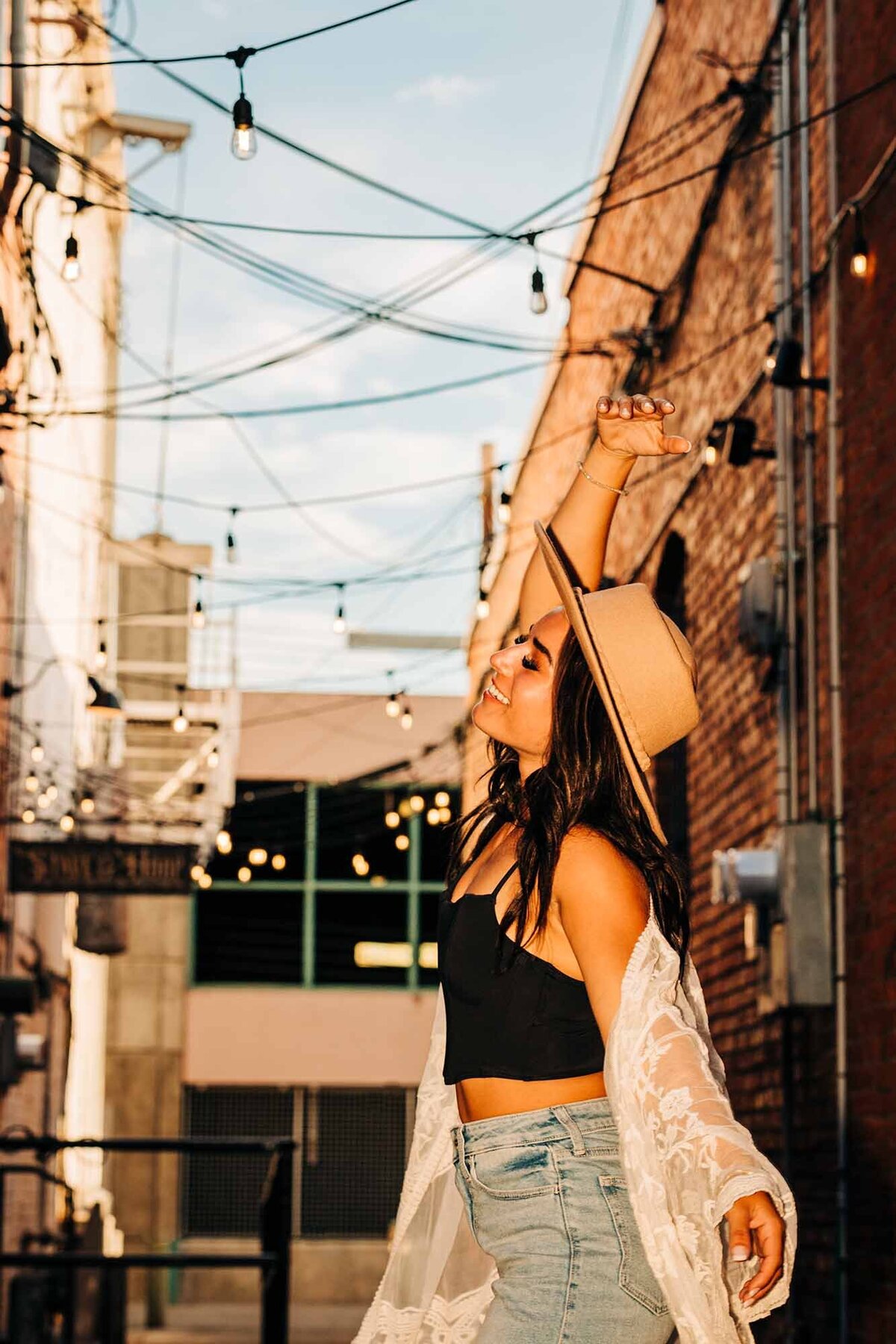 Senior photo of girl dancing in downtown Missoula