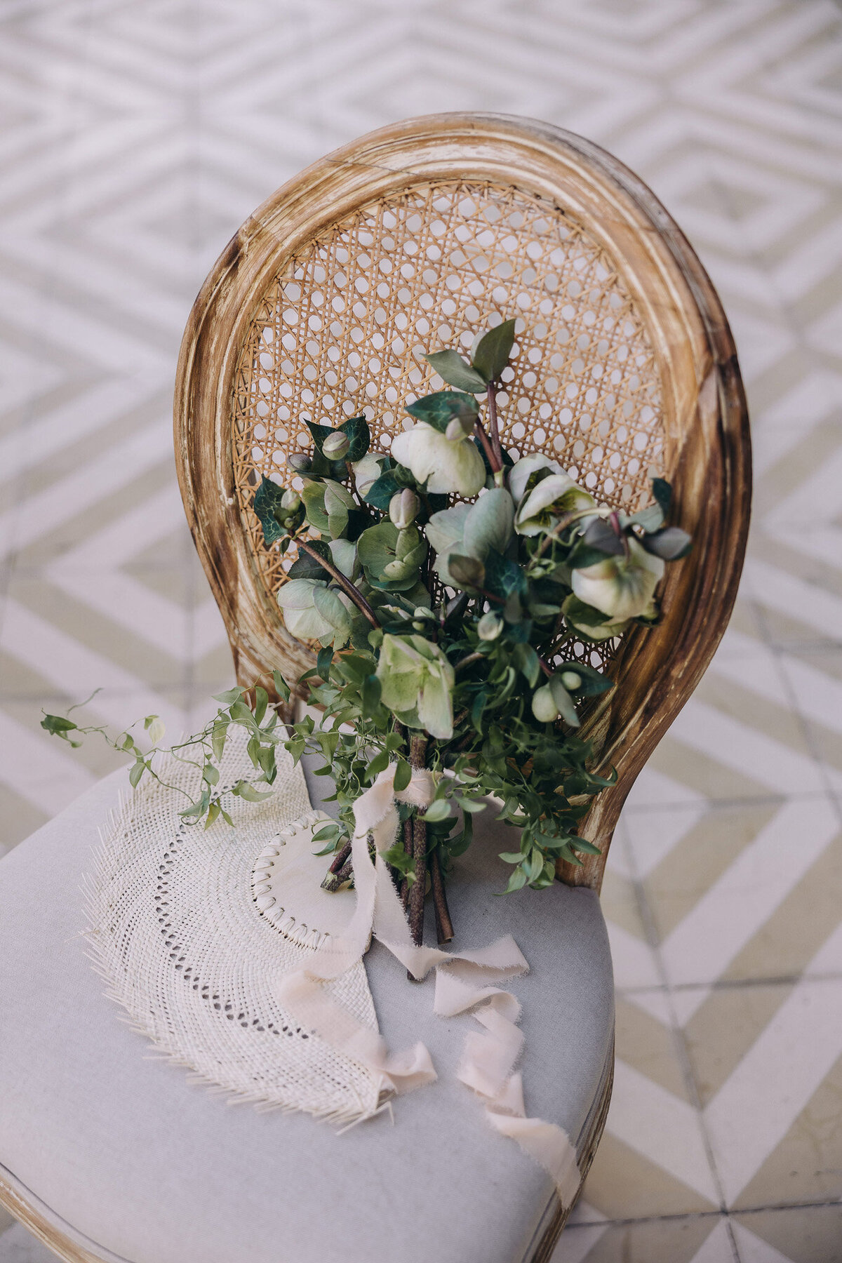 Rustic wedding bouquet in ivory, sage, and white with ribbon
