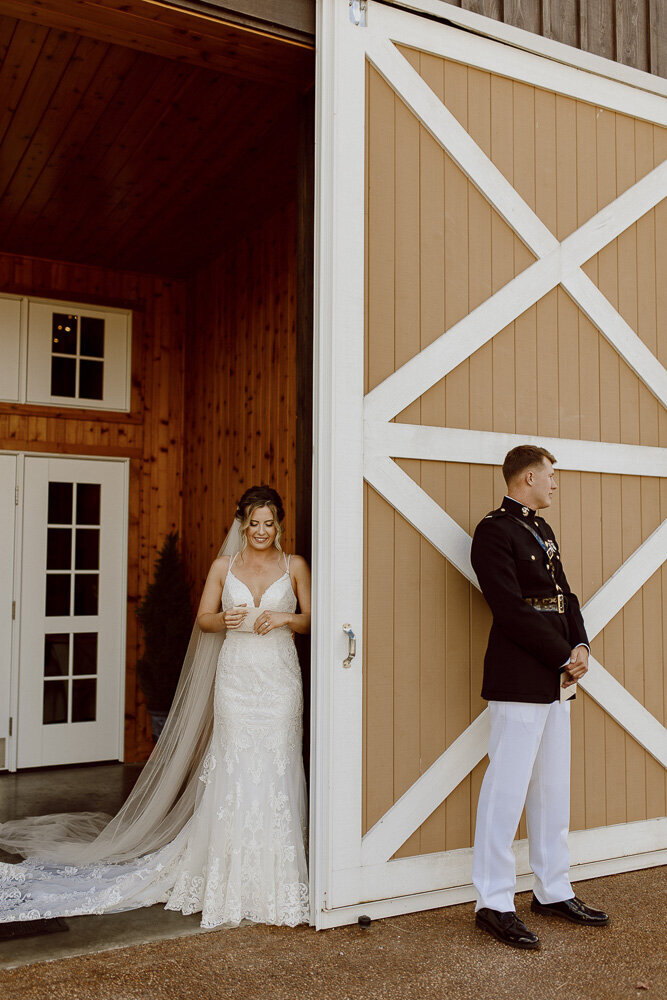 Bride and Groom standing back to back during their wedding first touch