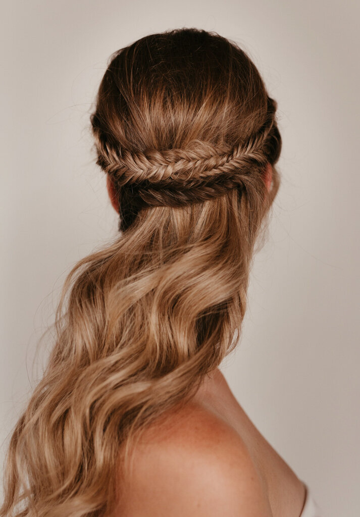 Romantic and simple fishtail half-up bridal hairstyle by Veil Beauty Co, Edmonton hair & makeup artist, featured on the Brontë Bride Vendor Guide.