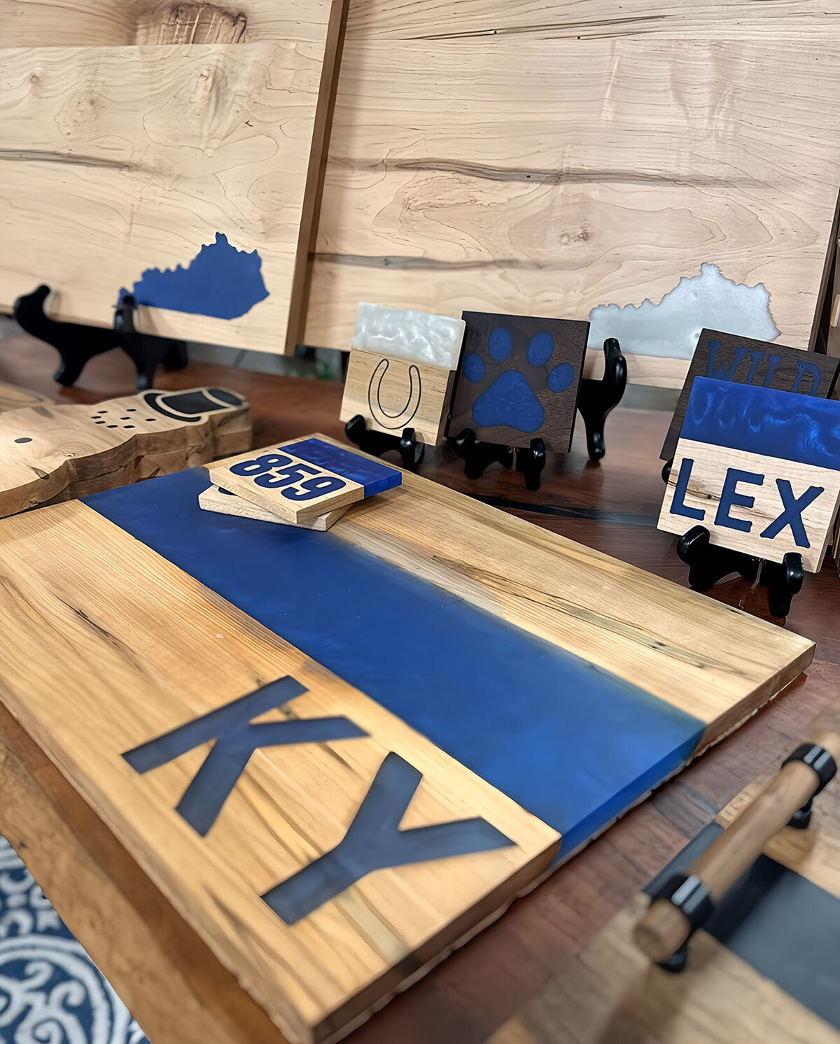 Fish's Designs wooden Kentucky coasters and charcuterie boards