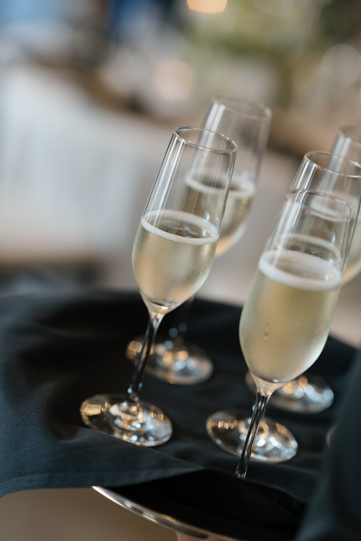 film style wedding photography of champagne flutes taken by Shelby Ann Photos
