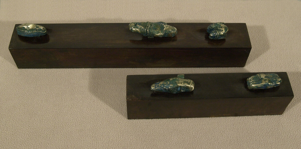 Bronze and steel titled Artifacts