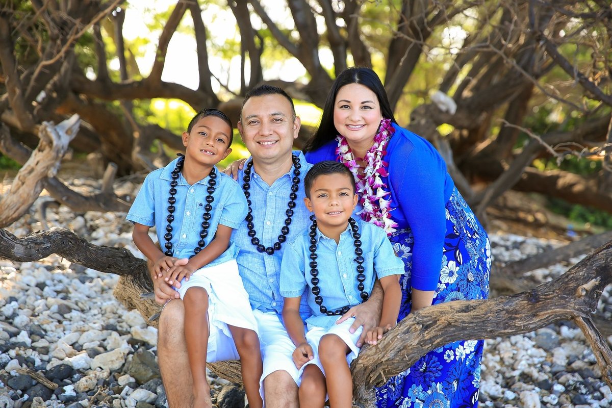 Capture Aloha Photography, Maui Family Portraits sitting at the branch of tree on the beach