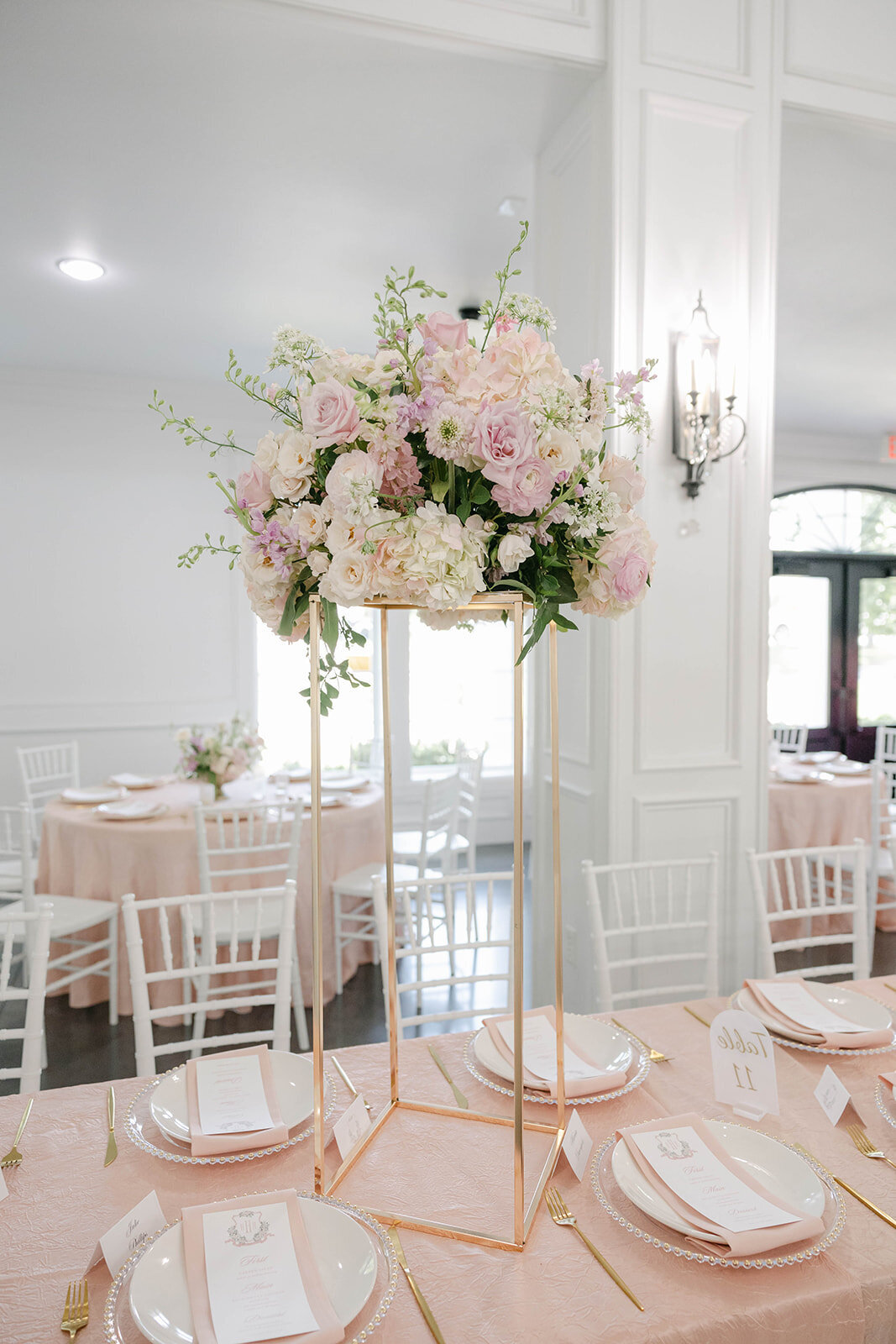 floral arrangement of Blush rose, white hydrangeas, and lush greenery