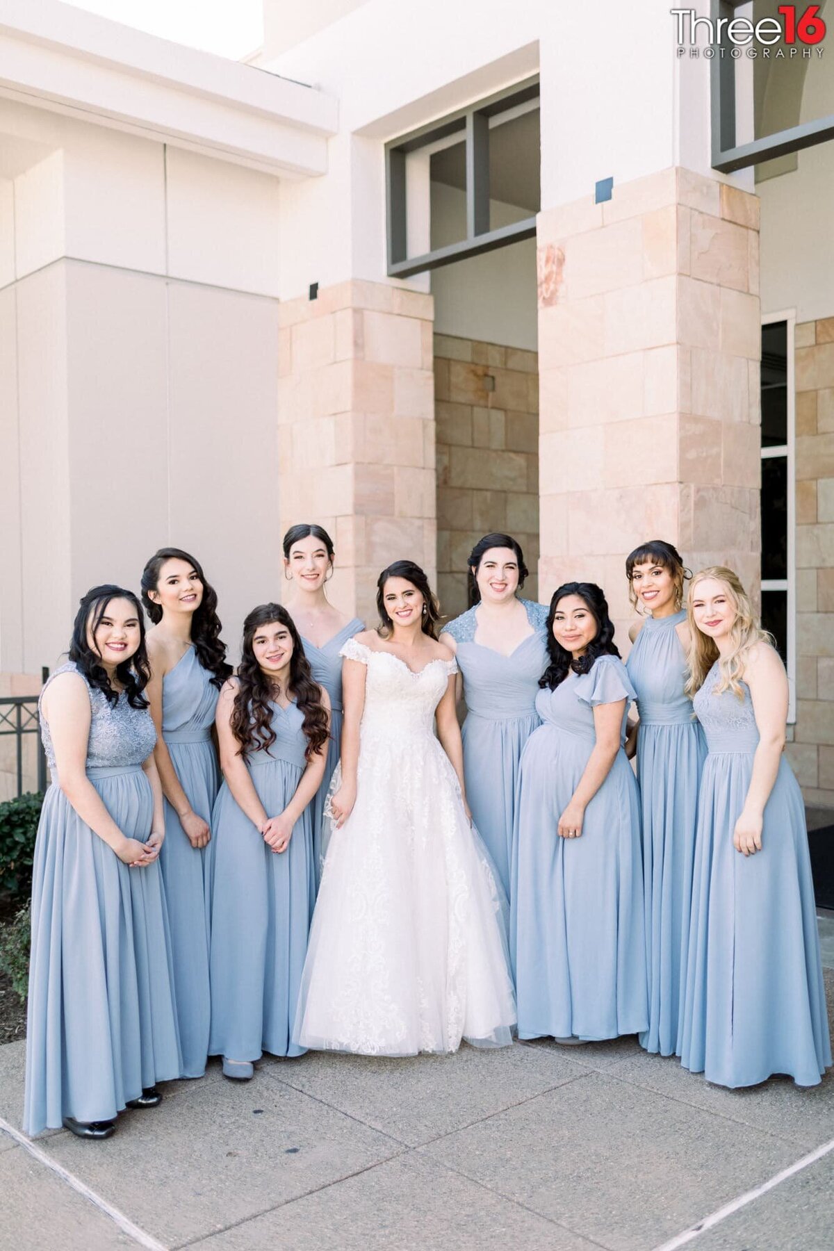 Bride poses with her Bridesmaids