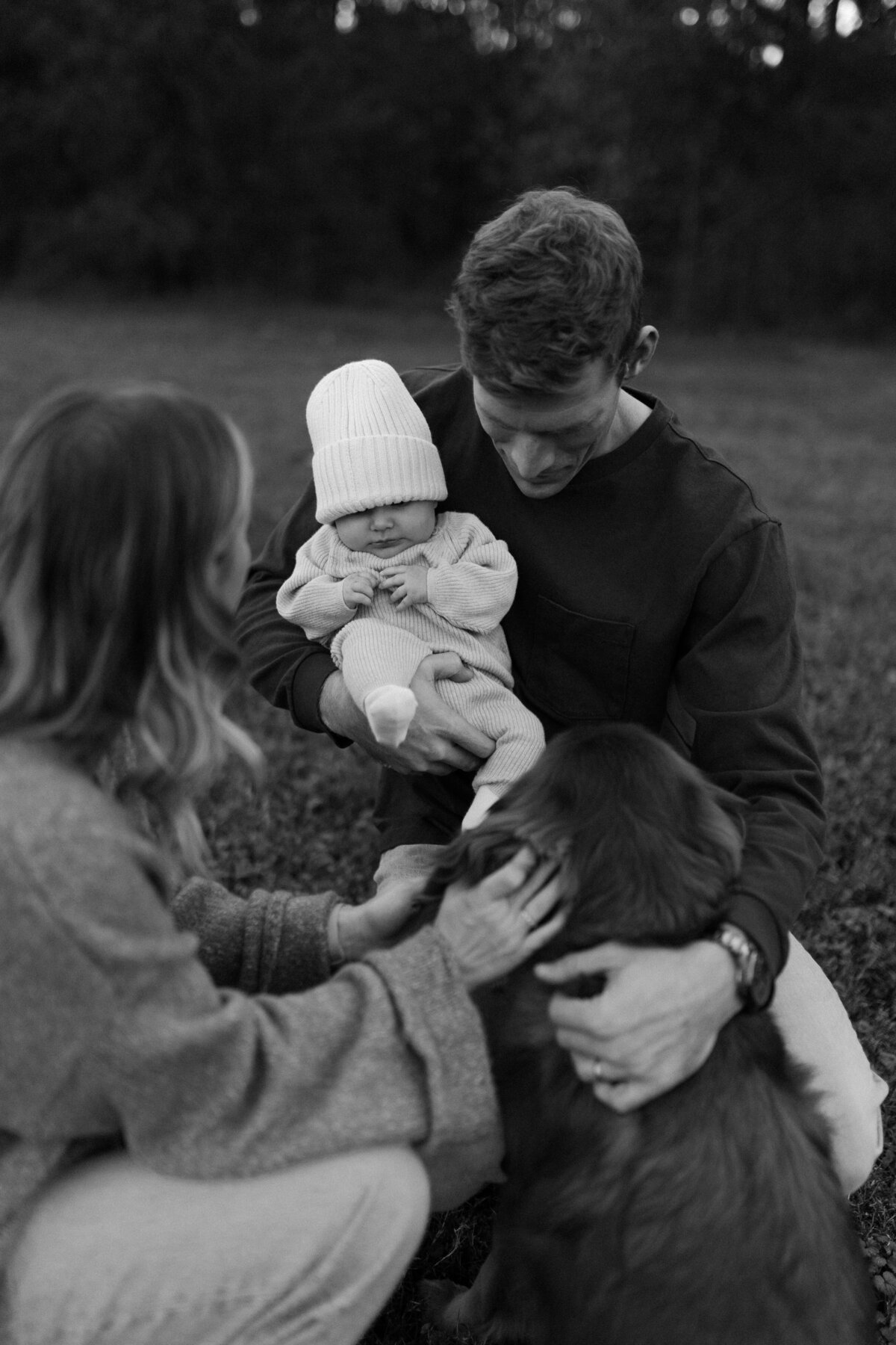 family gathers around baby
