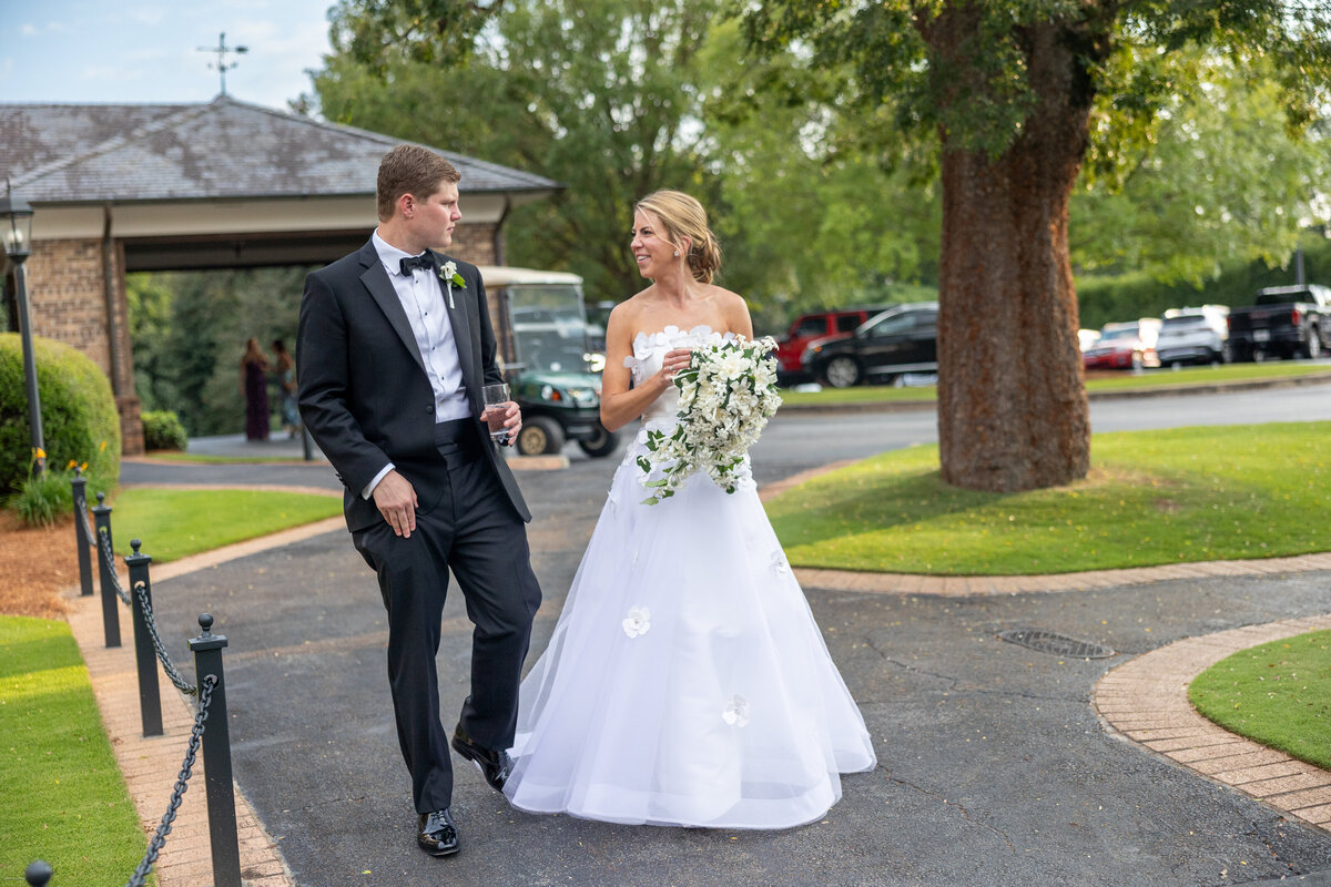 Bride and Groom walking at Peachtree Golf Club Wedding