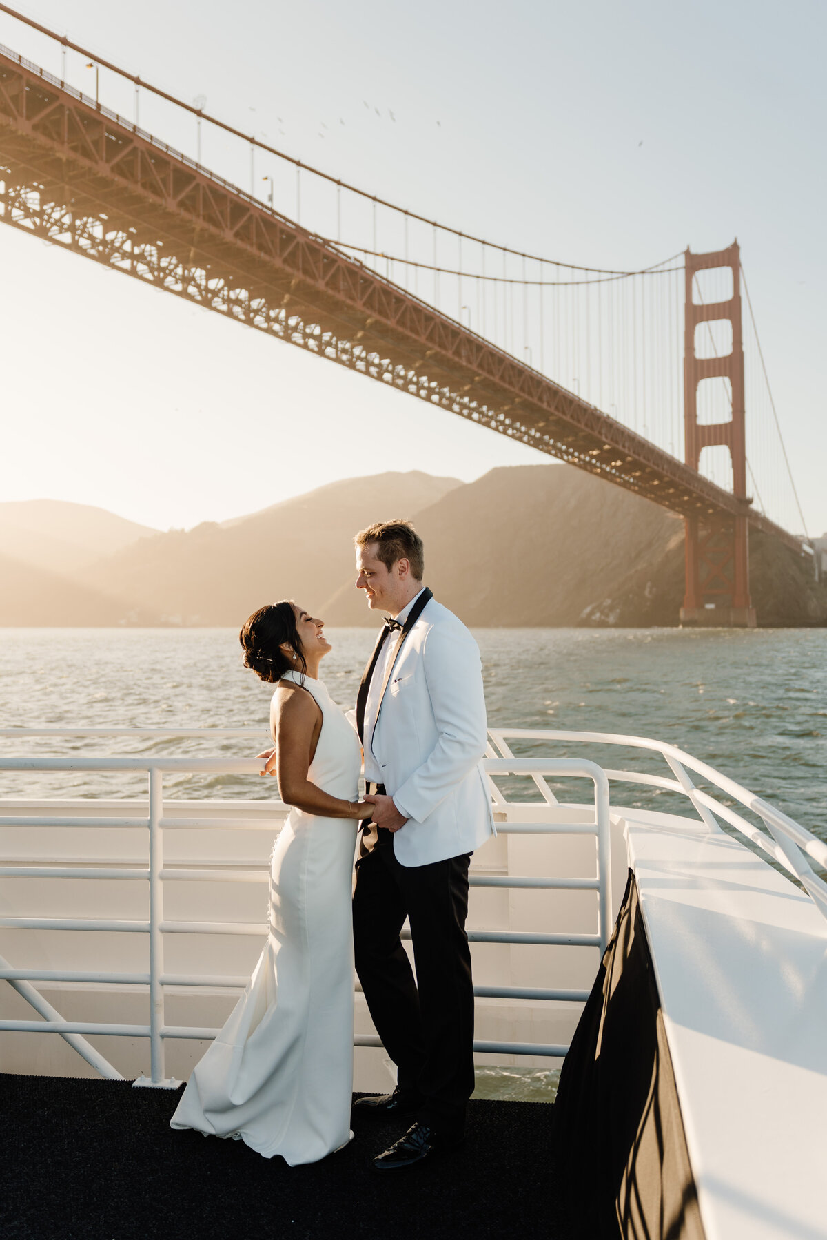 bride and groom wedding portrait under golden gate bridge