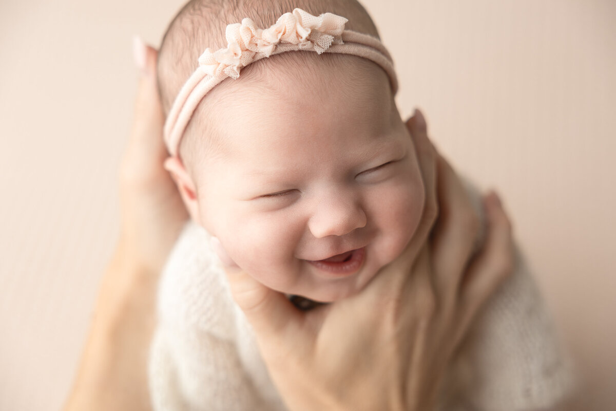 Newborn baby girl in pink Edmonton studio photography 
