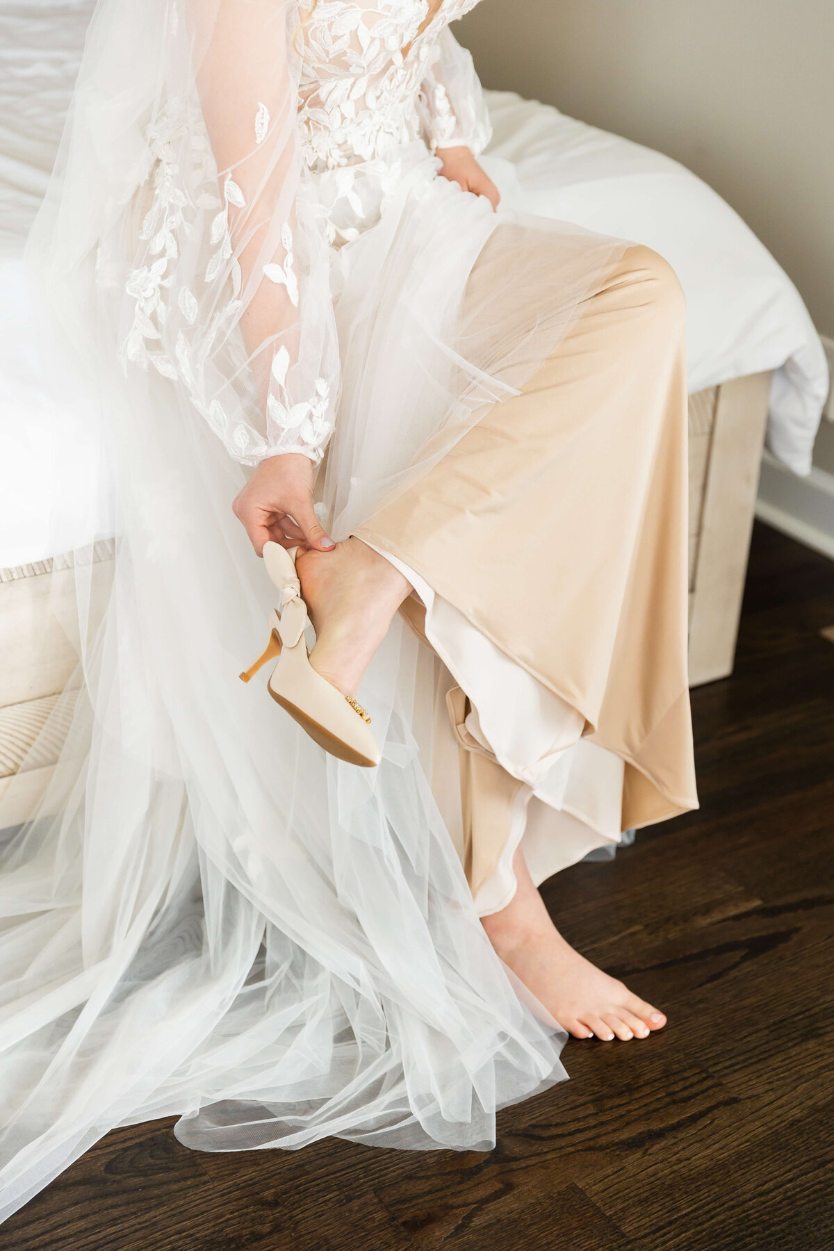 Bride putting on shoes before Nashville wedding