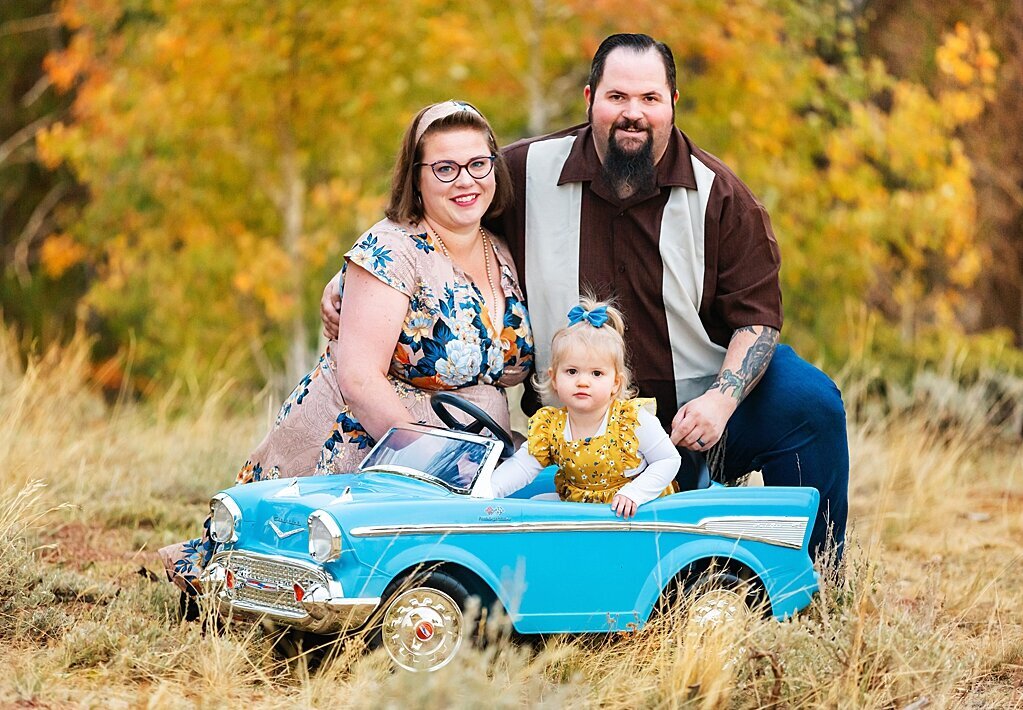 Fall family portrait in antique blue car in Happy Jack.