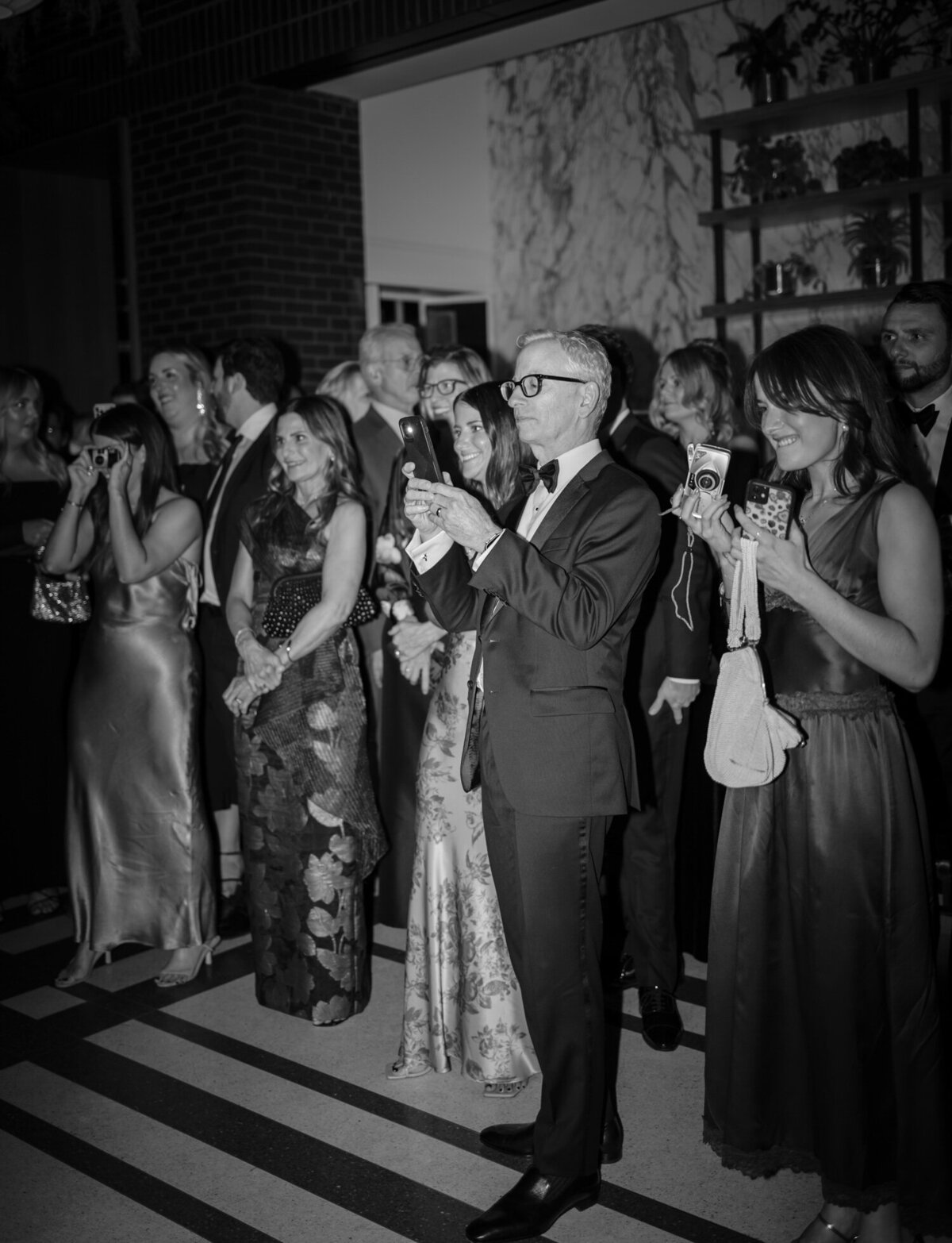 Guests cheer for dancing bride and groom at Shinola Hotel, Detroit 