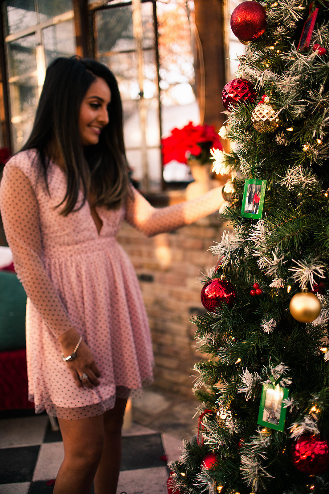 Plan the perfect proposal woman looking at Christmas tree