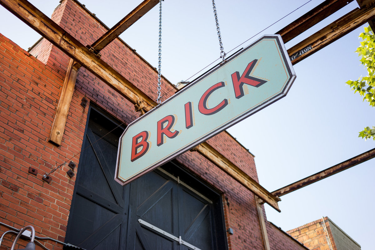 Detailed portrait of the sign in front of wedding venue Brick at Blue Star in down town San Antonio near riverwalk