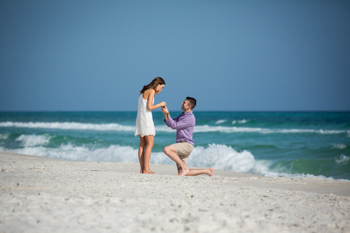 surprise proposal by a guy on the beach at Rosemary Beach, Florida  Florida, taken by Gwyne of https://gwynegrayphotography.com