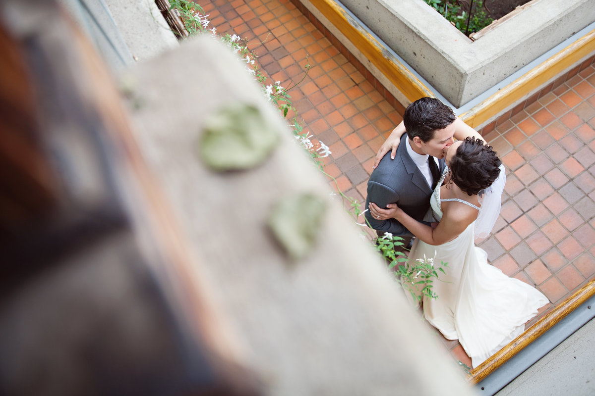 bride and groom kissing from above birds eye view