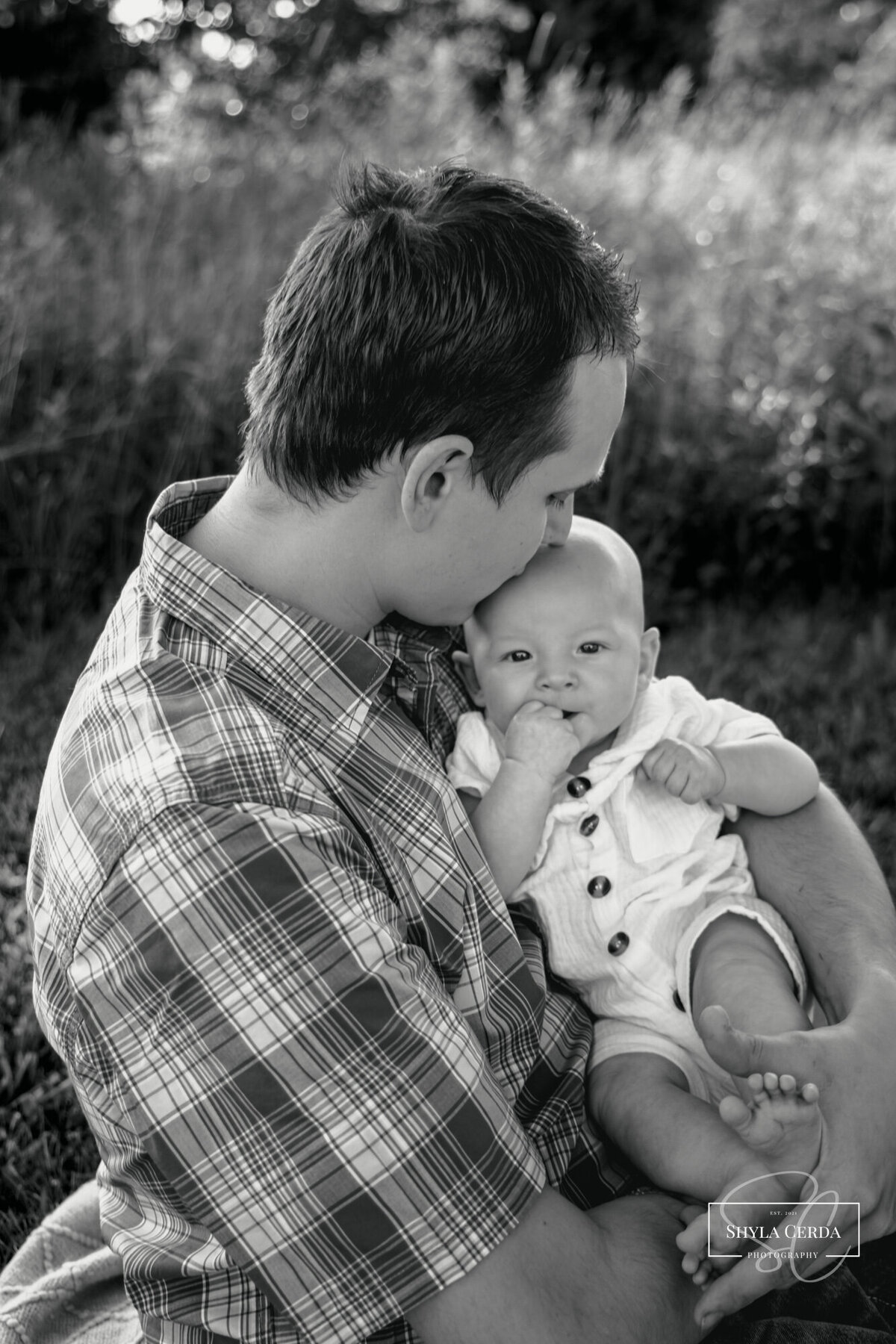 First time dad snuggles his son