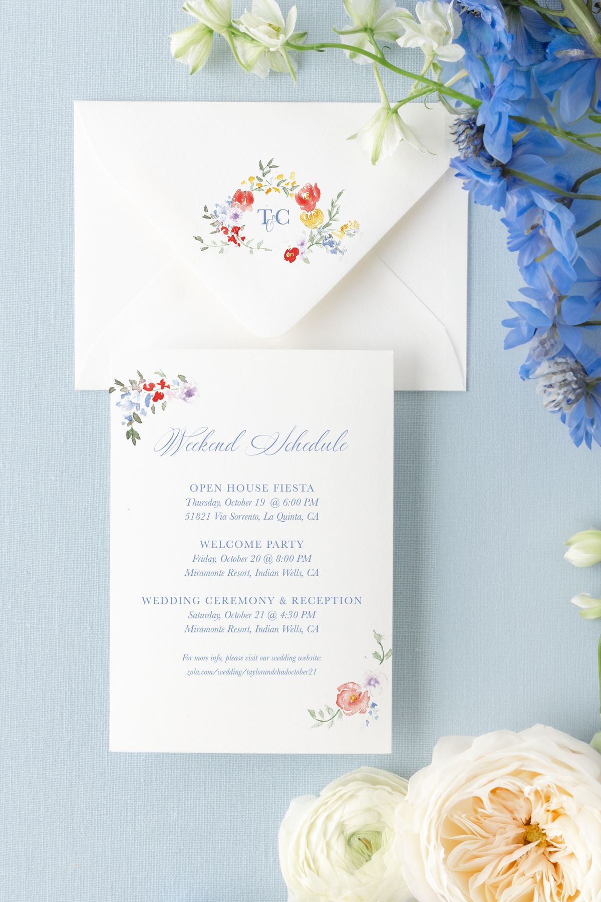 floral painted watercolor wedding itinerary on a blue background