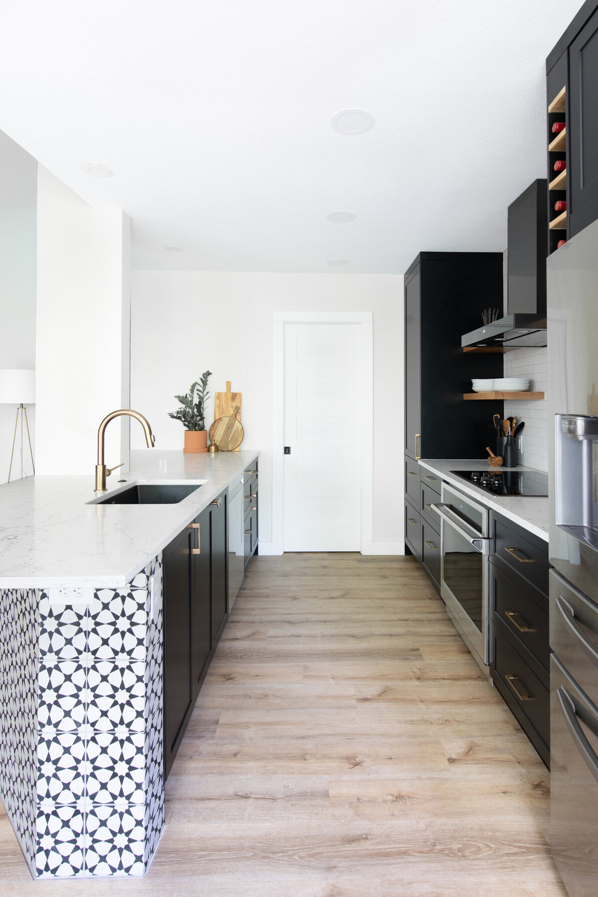 hello-home-austin-modern-black-and-white-kichen-remodel-patterened-wall-tile-open-shelves-black-cabinets-peninsula-with-post-26