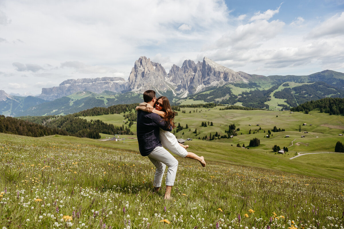 sweet couple intimate Alpe di Siusi mountain meadow view