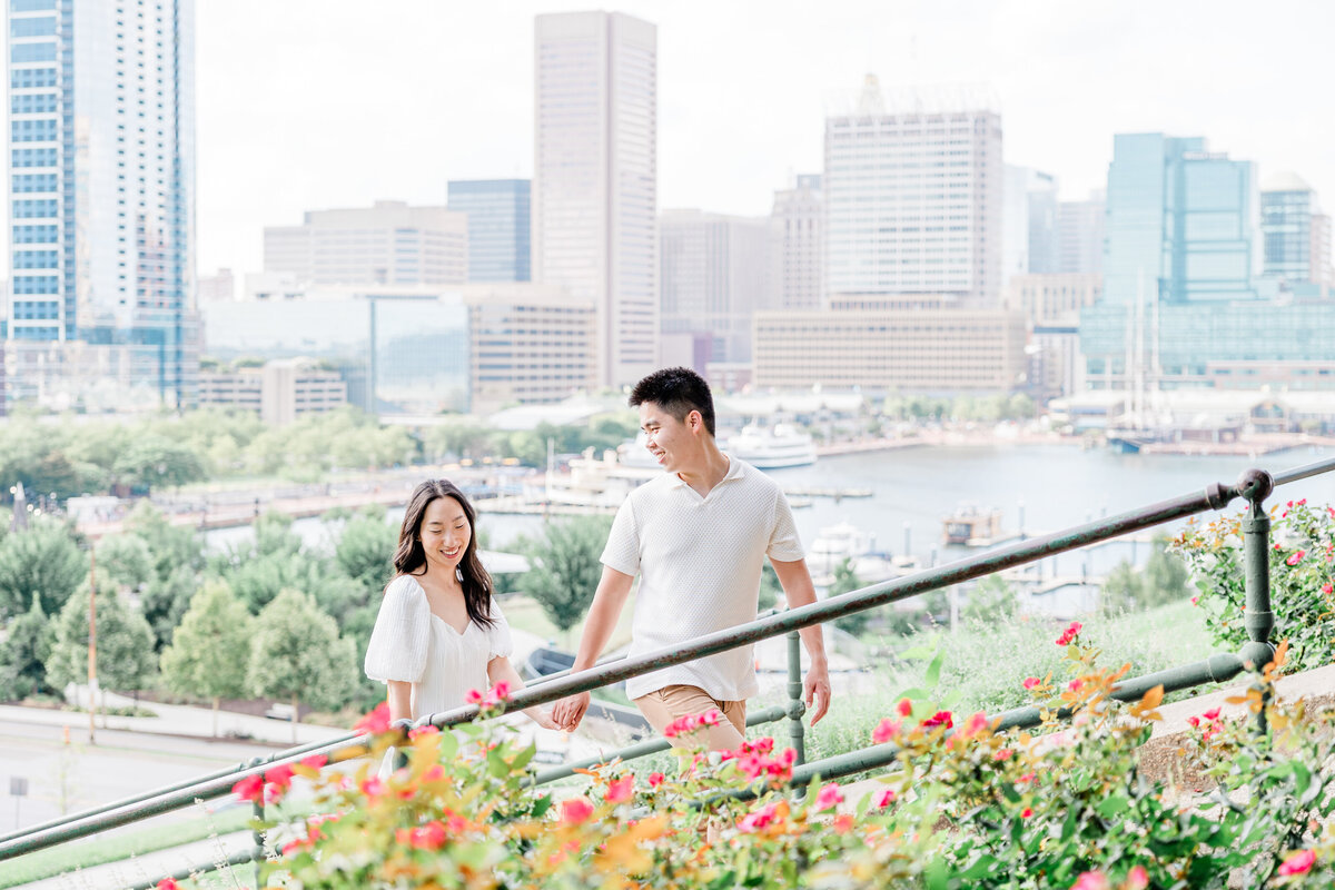 couple holding hands walking up stairs at federal park, m
