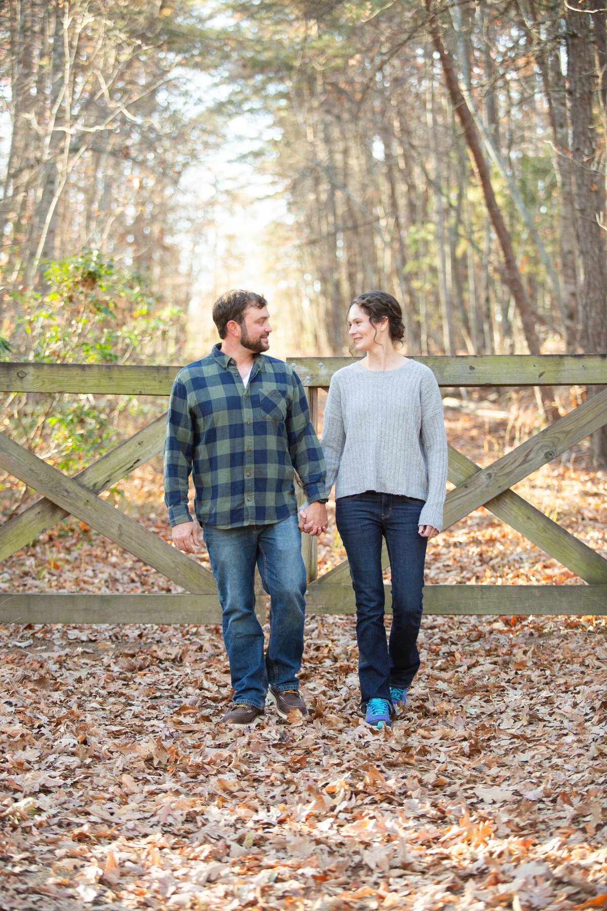 couple-walking-wood-gate