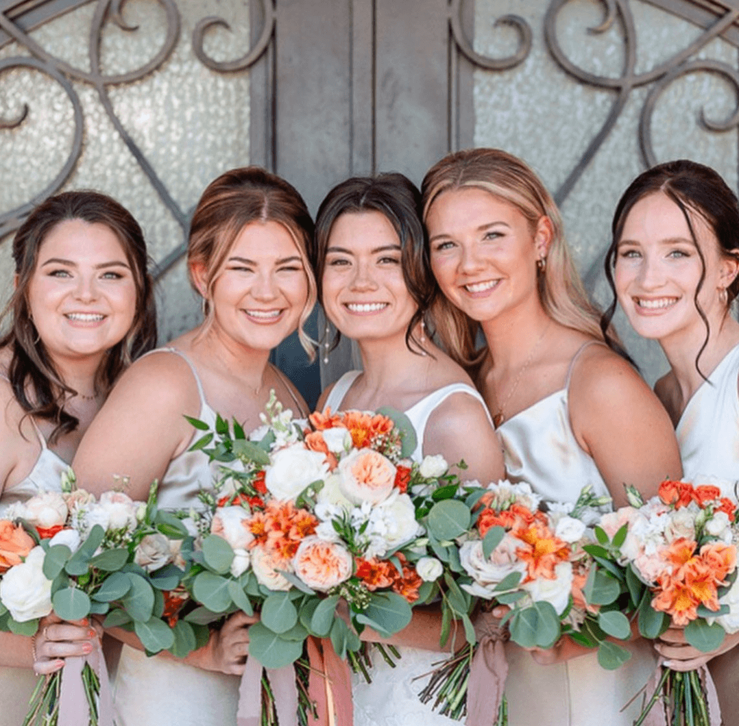San Antonio bride and bridesmaids with flawless hair and makeup, showcasing bridal party beauty services and soft glam looks