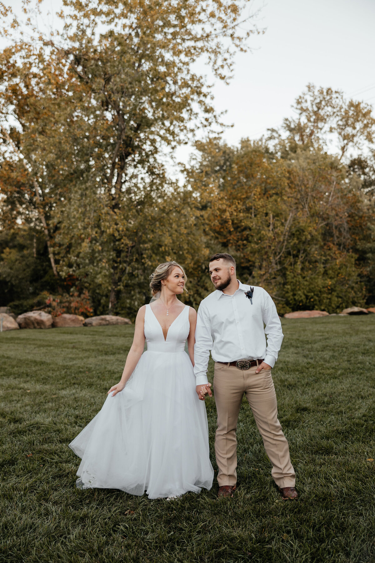 bride and groom outdoors in the fall