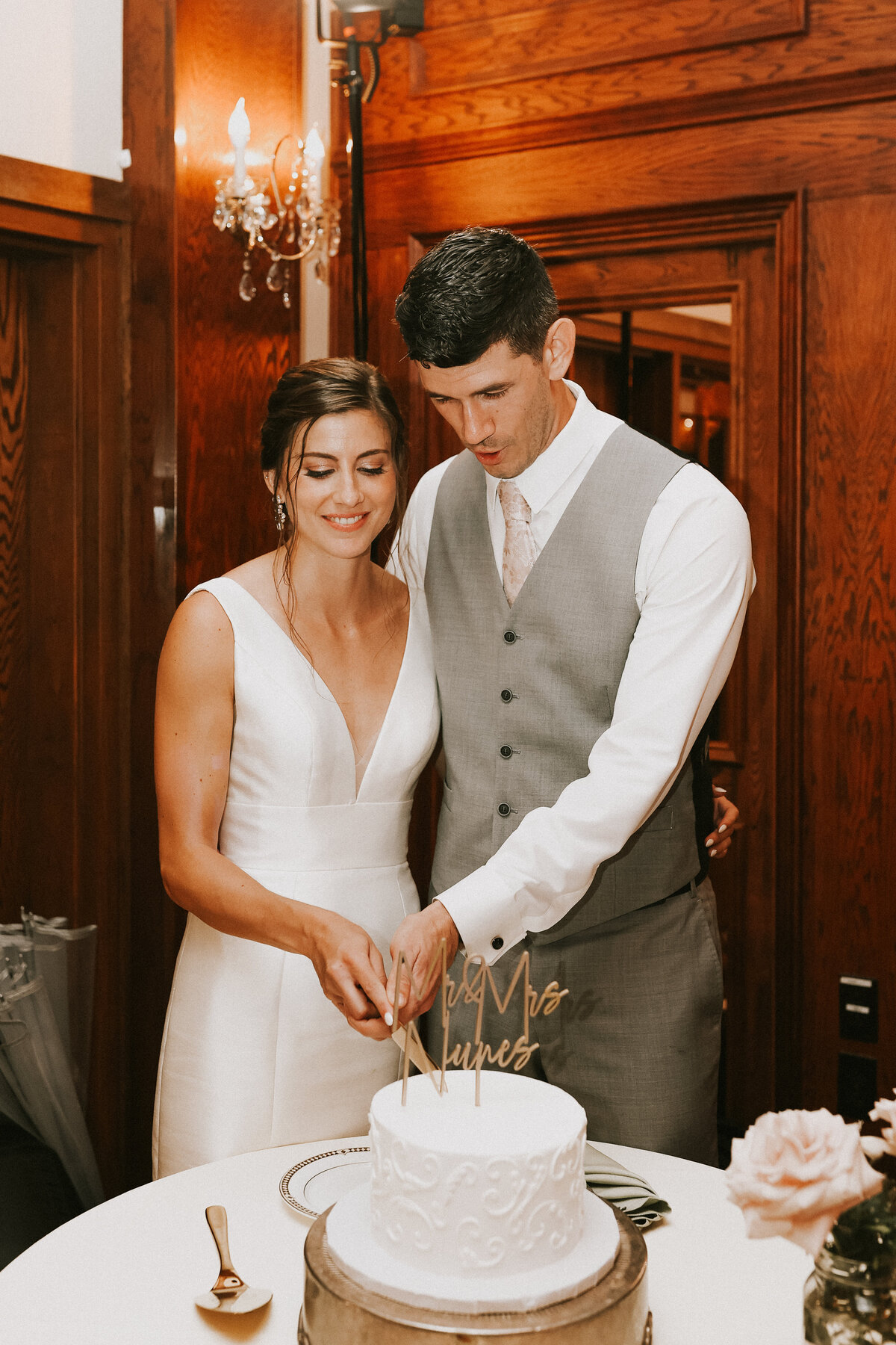wedding-cake-cutting-bride-and-groom-saint-clements-castle