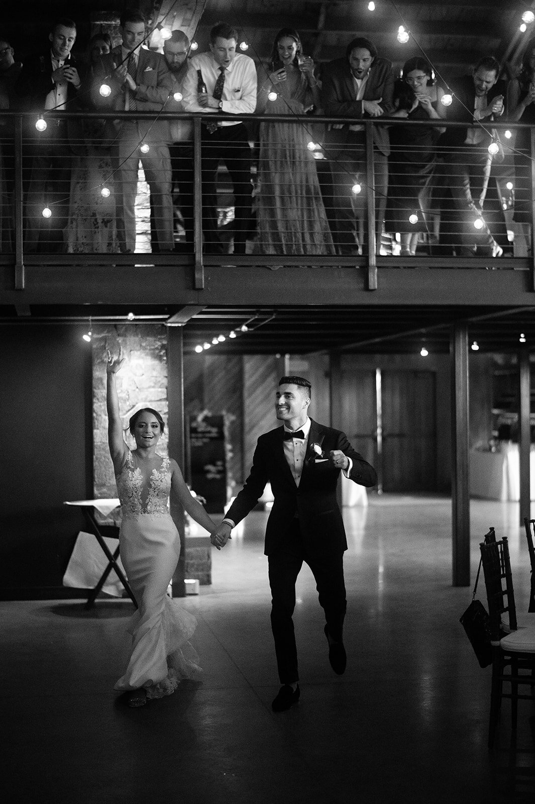 bride and groom make entrance at wedding reception at salwater farm vineyard wedding photo by cait fletcher photography