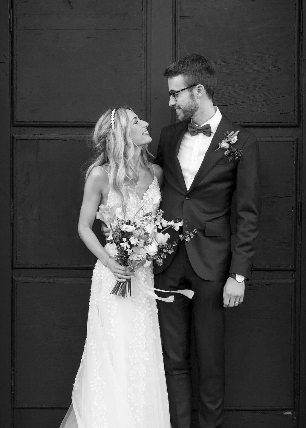 Bride and Groom looking at each other in black and white