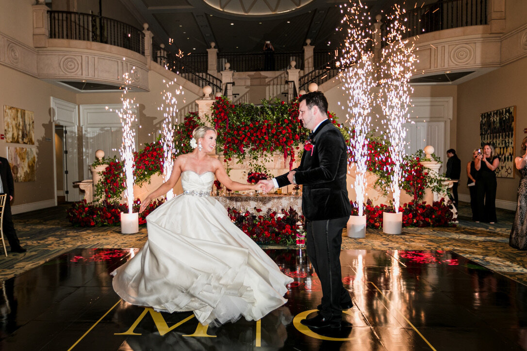 First dance, ballgown, cold sparklers, red roses, sweetheart table, red flowers, phantom of the opera theme, staircase flowers