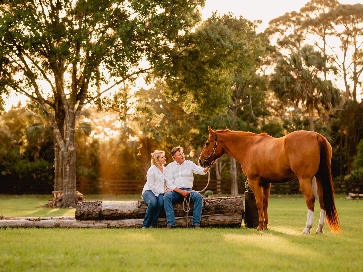 Equestrian couple has photos taken by professional horse photographer in Wellington, Florida.
