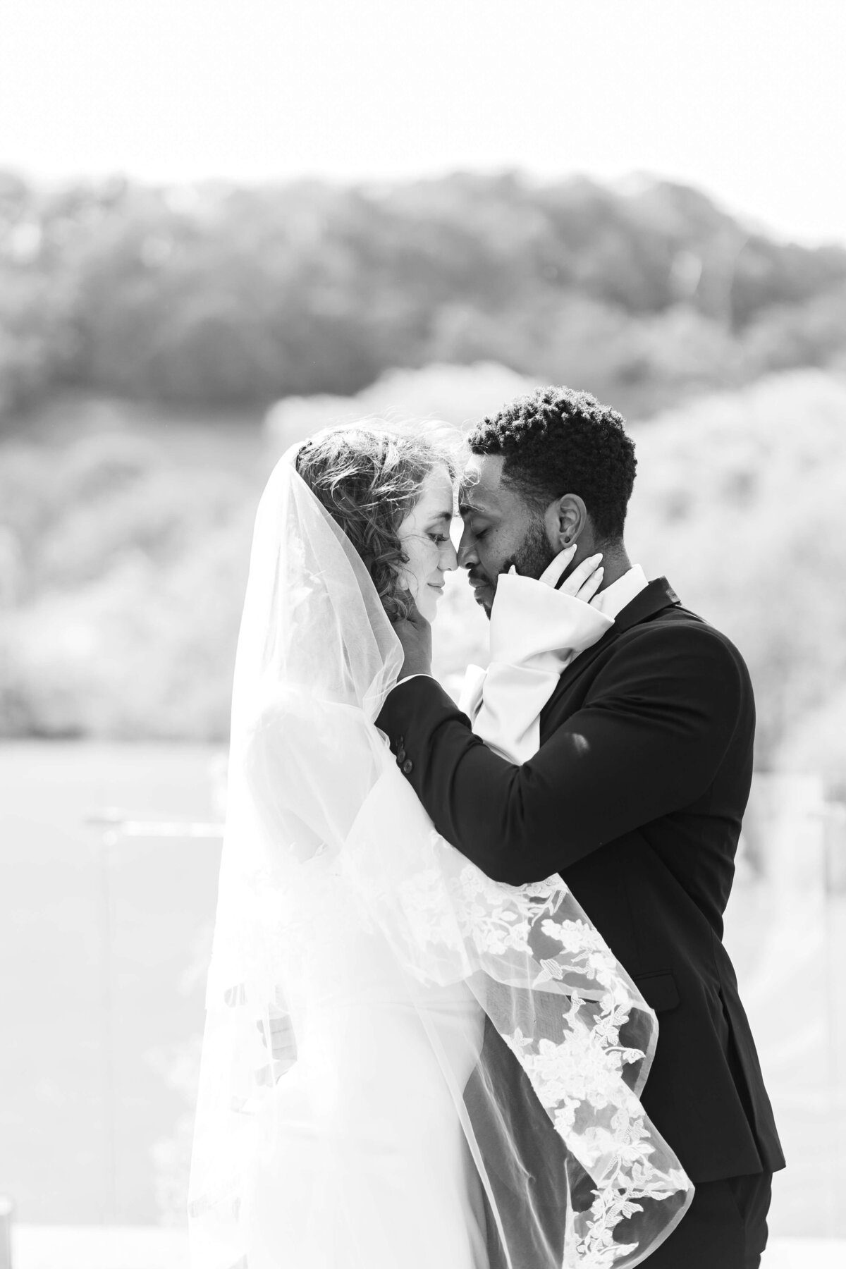 Bride and groom in an embrace at Diamond Creek farm wedding in Tennessee