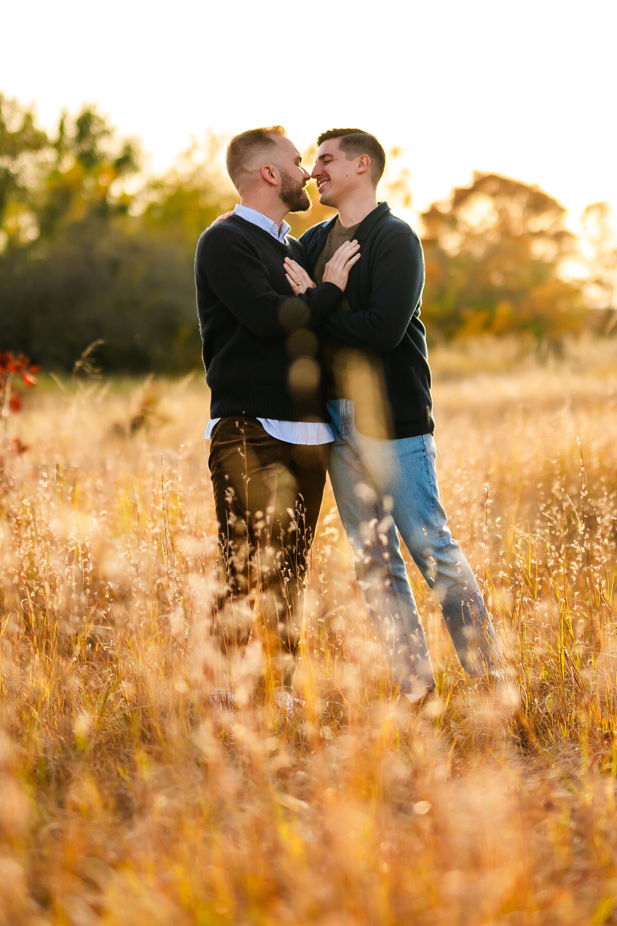 A couple embrace in a wheat field