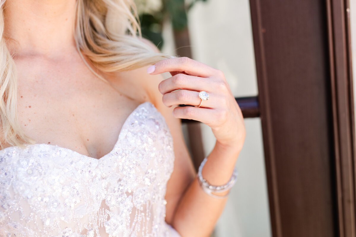 Bride's wedding ring and dress