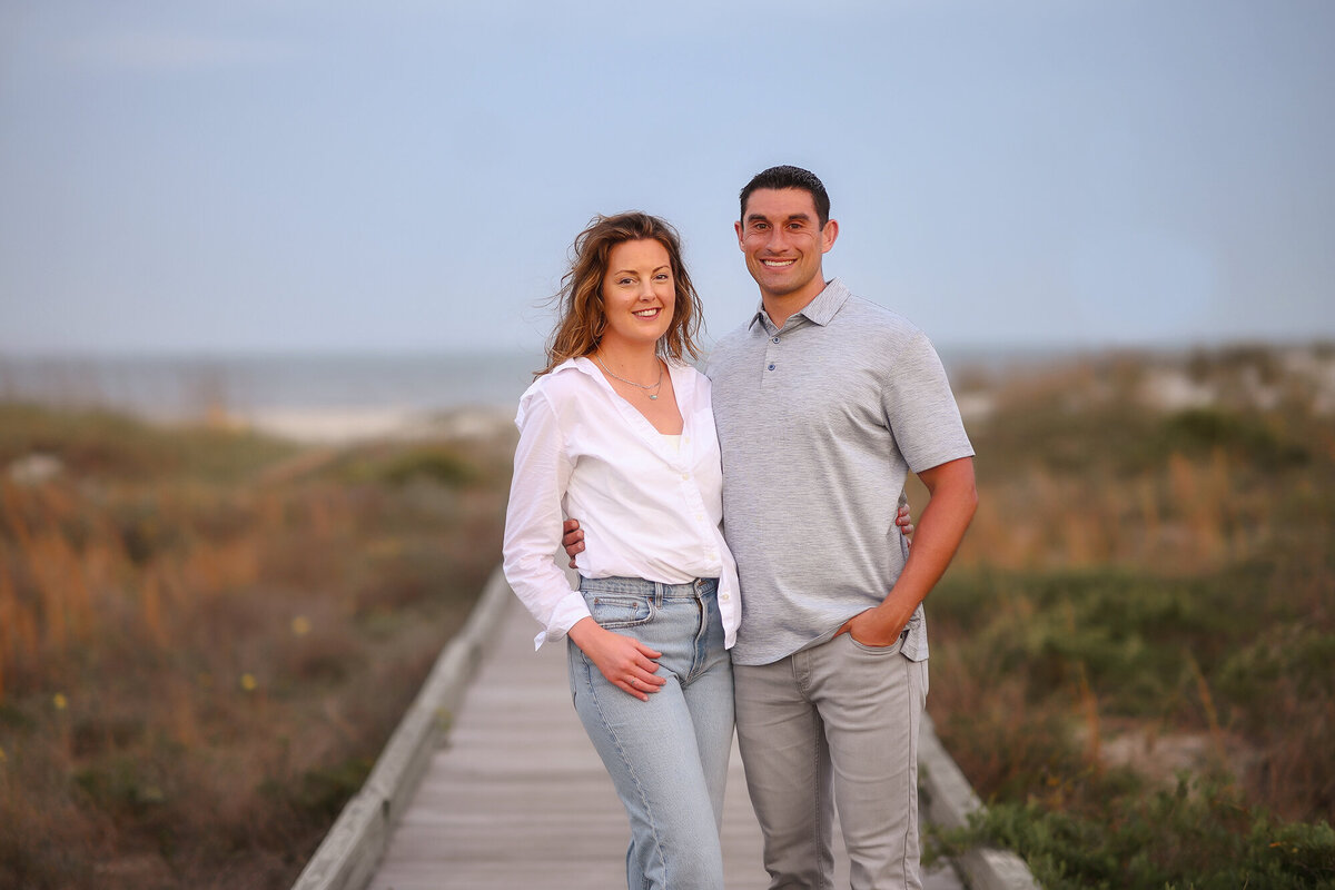 Couple embraces each other during Family Photos on Isle of Palms. 