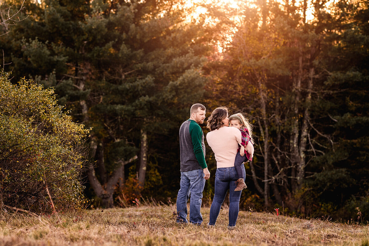 Intimate family moment in field at wagon hill in durham nh by Lisa Smith Photography