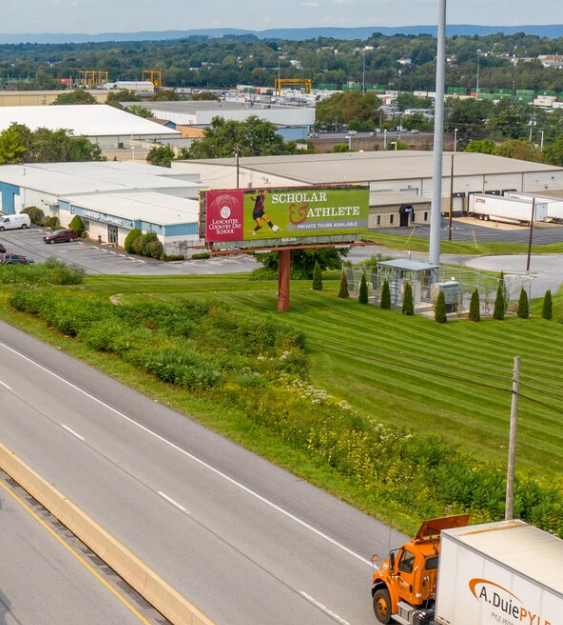 Scholar and athlete billboard placement along highway