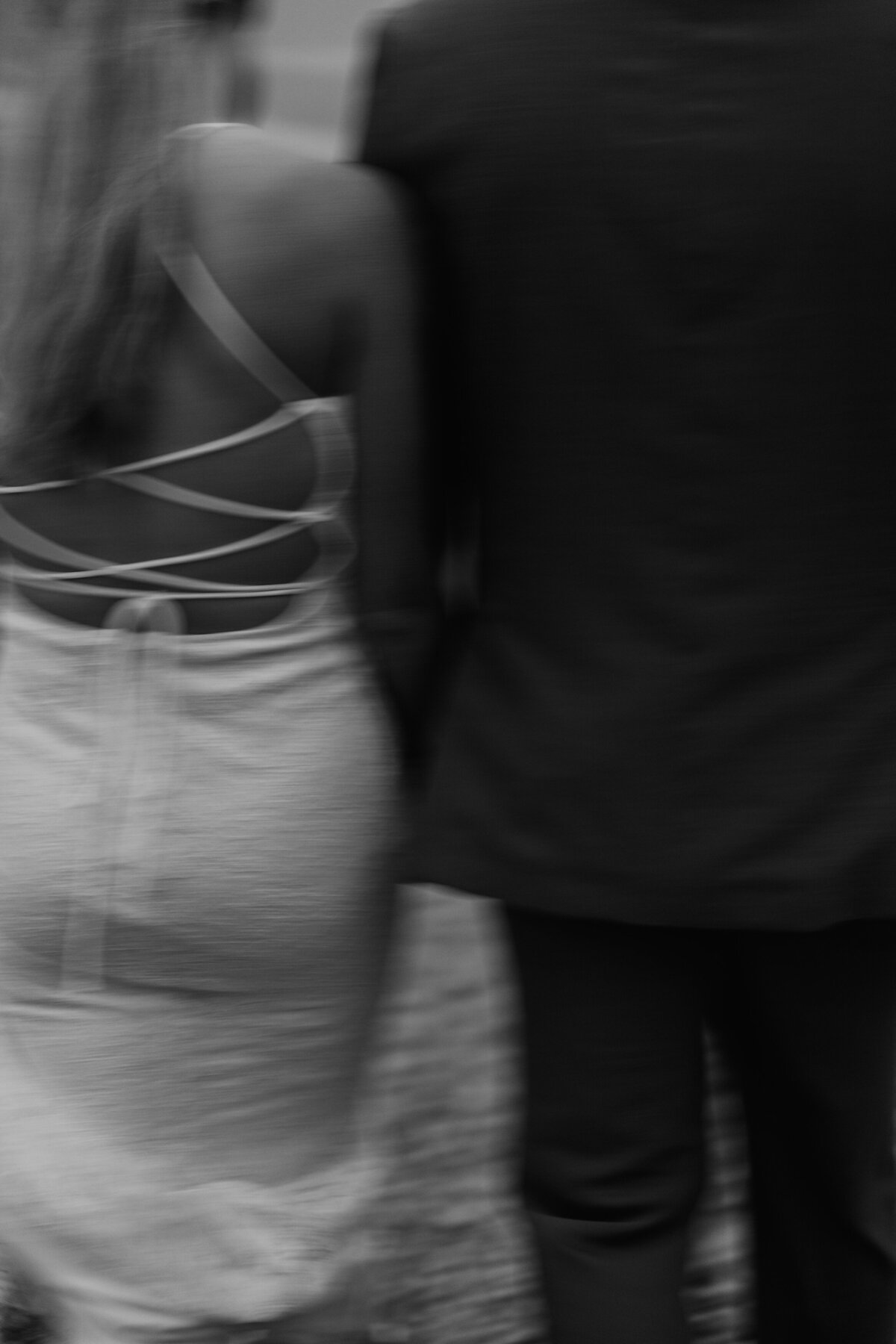 Blurred black and white photo of couple standing together