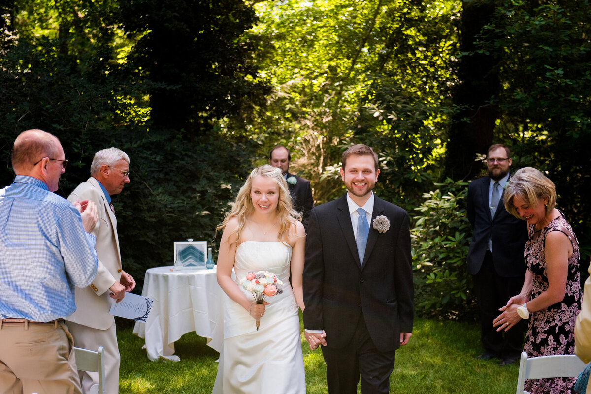 couple exiting their wedding ceremony at the Hyeholde restaurant