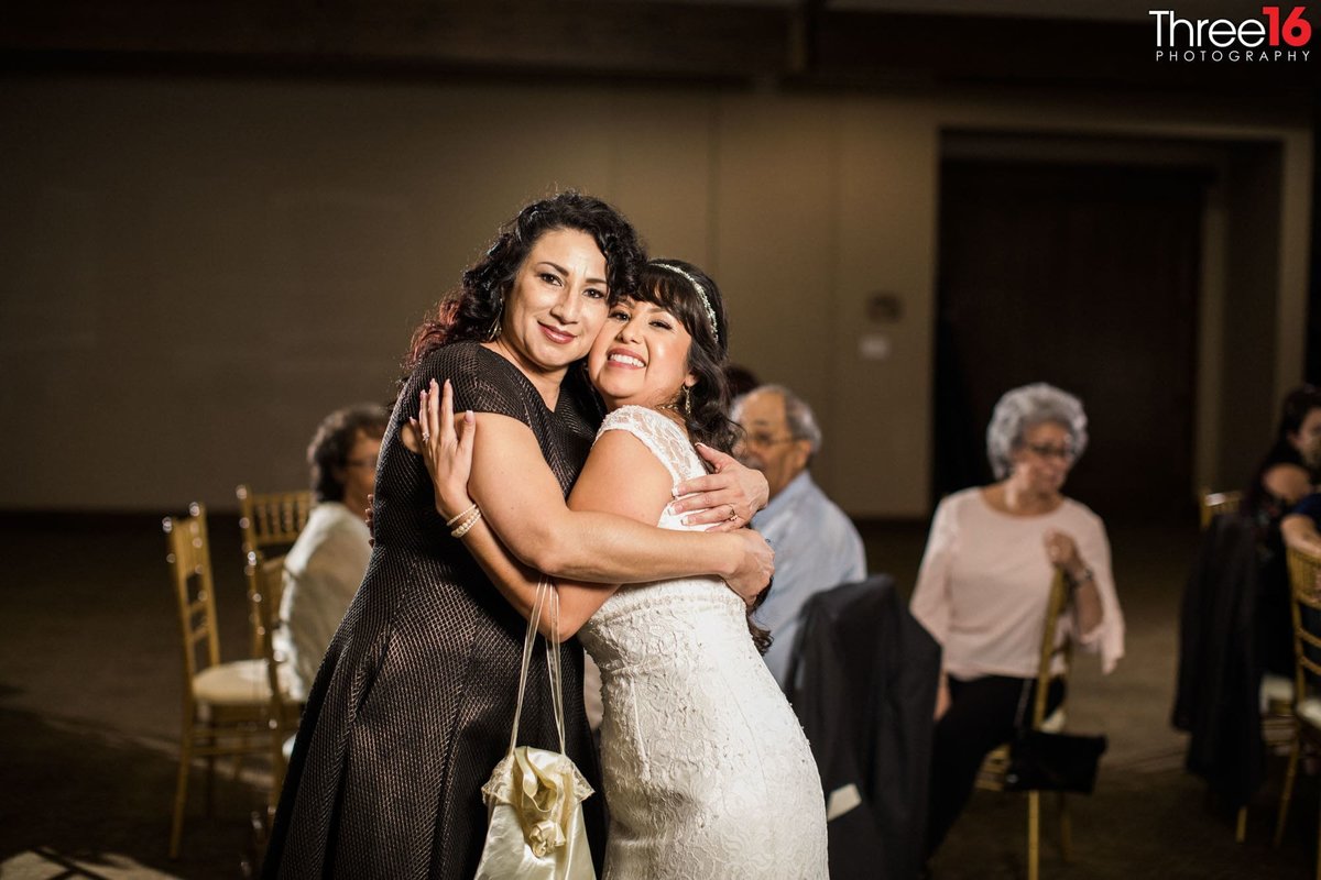 Bride shares a hug with her mom
